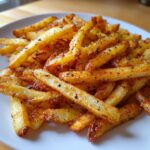 Crispy Air Fryer Seasoned French Fries, a close-up side view of golden-brown