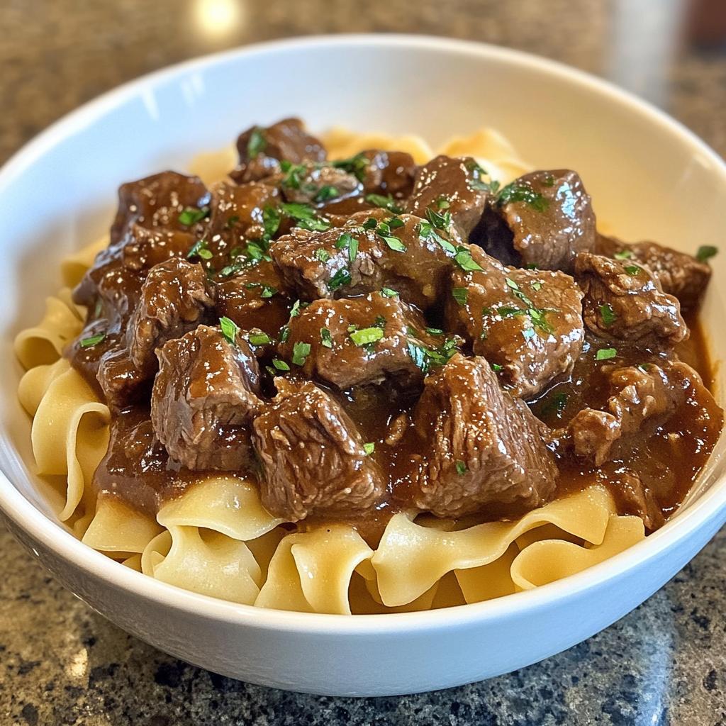 Ultra Tender 2-Ingredient Crockpot Beef Tips & Noodles