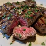 Garlic Butter Brazilian Steak. A perfectly cooked sirloin steak, sliced to show the juicy pink interior with a caramelized crust