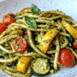 Pesto Pasta with Roasted Vegetables, featuring al dente pasta coated in vibrant green pesto