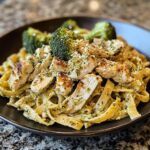 mouthwatering pesto chicken alfredo with spicy feta cream parmesan broccoli crunch.
