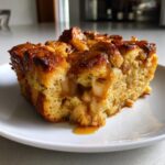Caramel apple bread pudding, warm, custardy, and sweetly spiced.