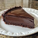 Chocolate ganache torte, deeply rich and decadent with a smooth finish.
