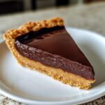 Chocolate peanut butter tart, silky ganache with nutty richness.