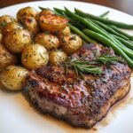 Garlic butter ribeye steak with skillet potatoes and green beans