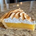 Lemon meringue tart with a zesty, tangy lemon curd and soft, toasted topping.