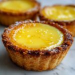 Mini lemon tarts with a smooth, tangy curd and crisp shell.