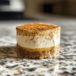 Pumpkin spice cheesecake bites, creamy with warm autumnal flavors.