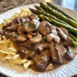 Beef Stroganoff with buttered egg noodles and roasted asparagus