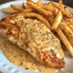 Chicken fillet in a spicy, creamy garlic parmesan sauce with French fries