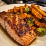 Maple Dijon Salmon with roasted Brussels sprouts and sweet potato fries