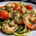 Zucchini noodle pesto with cherry tomatoes and grilled shrimp